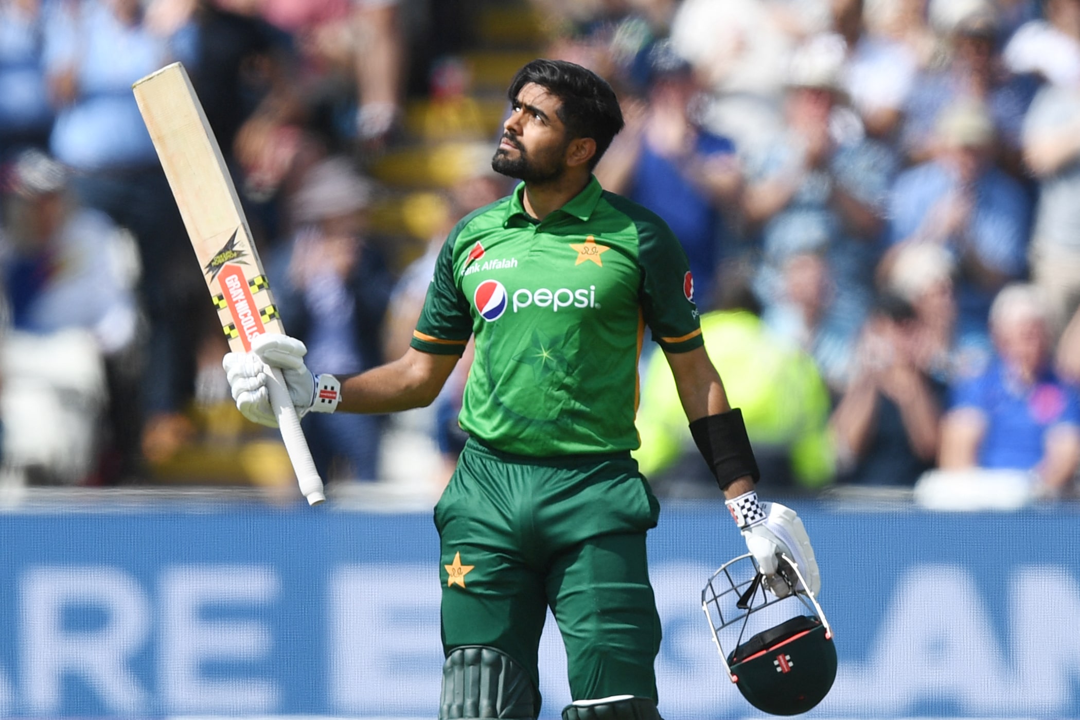 Pakistan's Babar Azam celebrates reaching his century during the third one day international (ODI) cricket match between England and Pakistan at Edgbaston cricket ground in Birmingham on July 13, 2021. (AFP)
