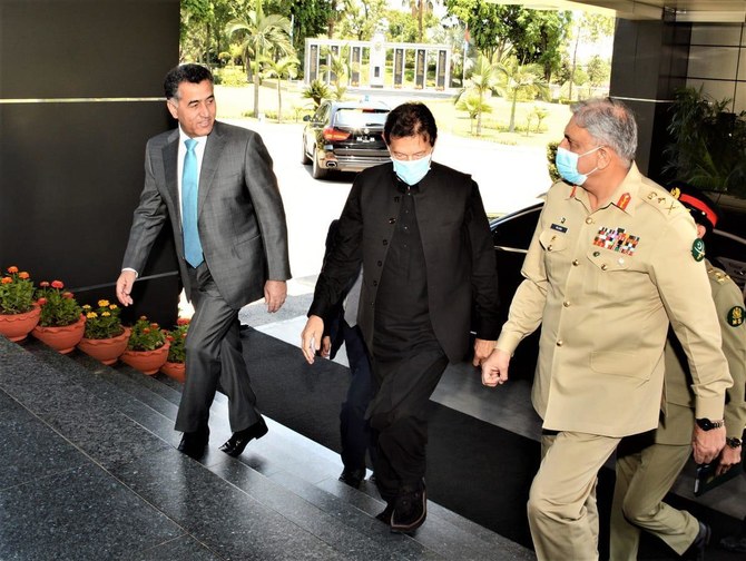 ISI chief Lt Gen Faiz Hameed (left) Prime Minister Imran Khan (center) Chief of the Army Staff General Qamar Javed Bajwa (right) enters ISI headquarters on May 24, 2021. (Pak PM Office)