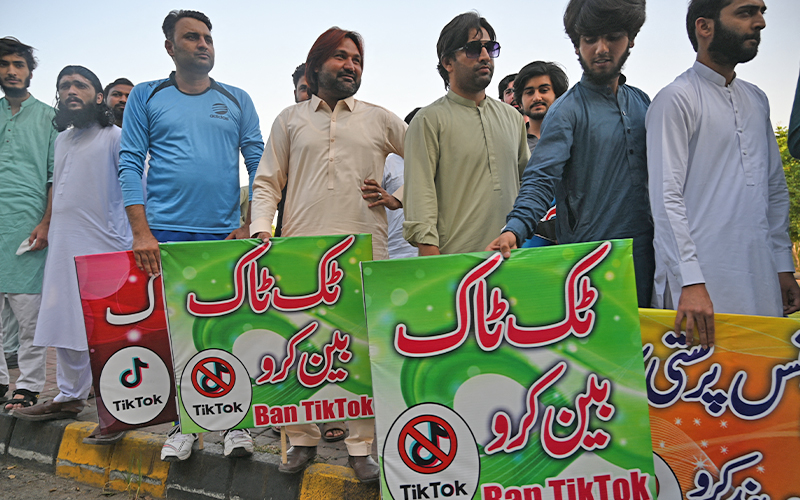 Activists carry banners and placards as they take part in a demonstration demanding the ban of a social media application 'TikTok' in Islamabad on June 26, 2021. (AFP/File)