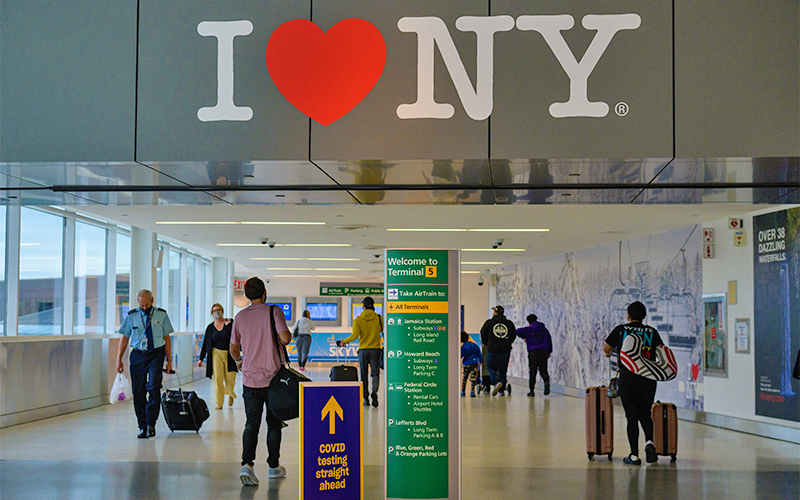 Travelers walk through John F. Kennedy (JFK) Airport on May 28, 2021 in New York City. (AFP/File)