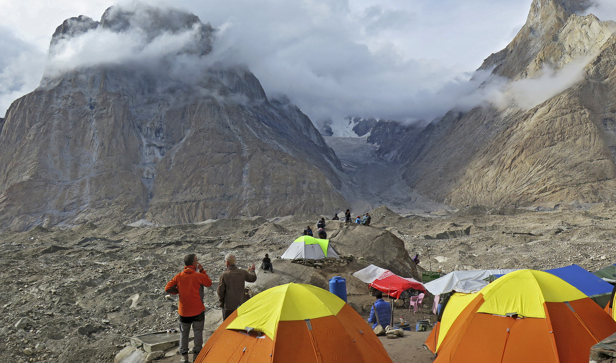 In this picture taken on August 12, 2019 foreign tourists and porters rest at a camping site above Baltoro glacier in the Karakoram range of Pakistan's mountain northern Gilgit region. (AFP/File)