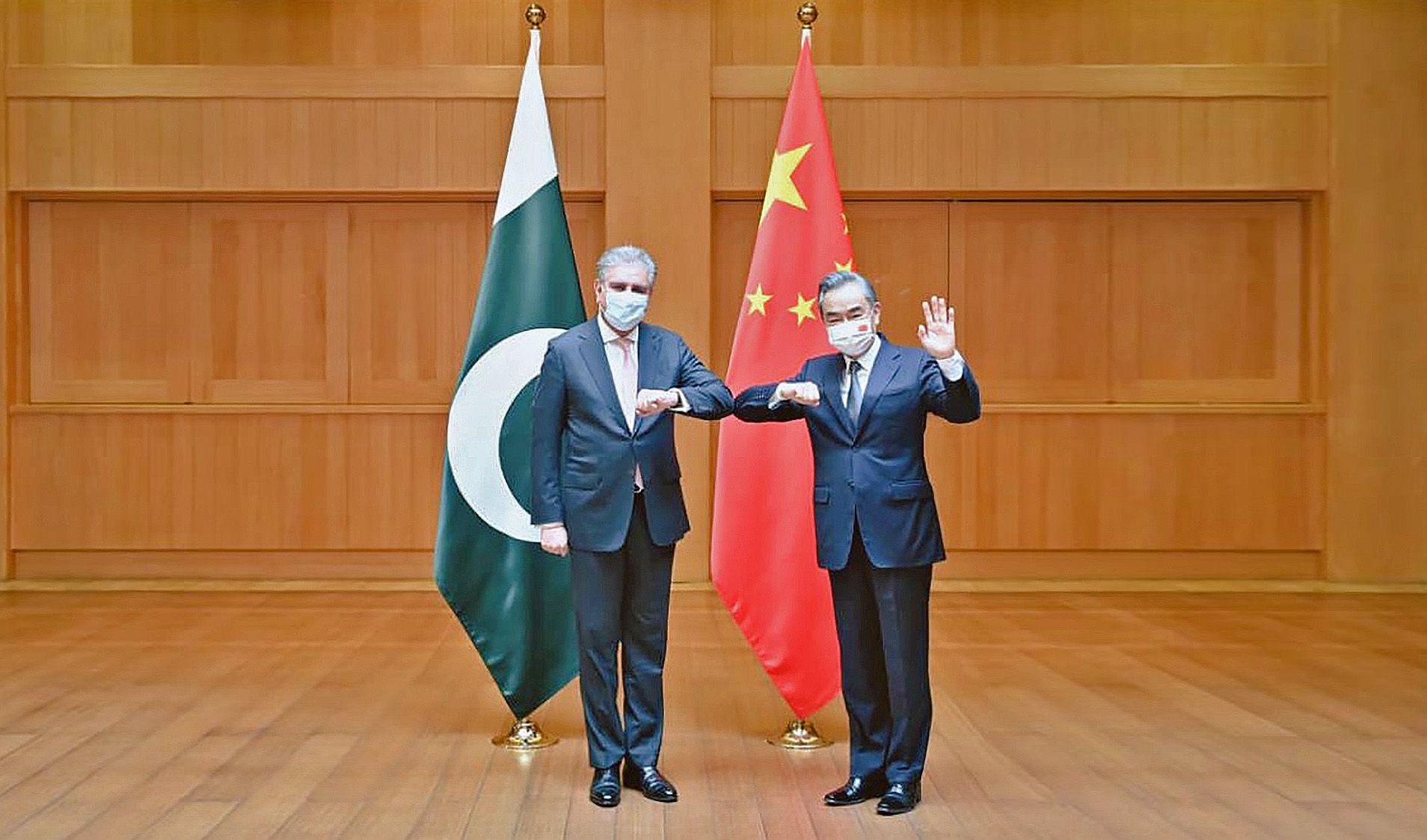 Pakistan Foreign Minister Shah Mahmood Qureshi, left, and his Chinese counterpart Wang Yi in China on July 24, 2021. (Photo courtesy: @SMQureshiPTI/Twitter)