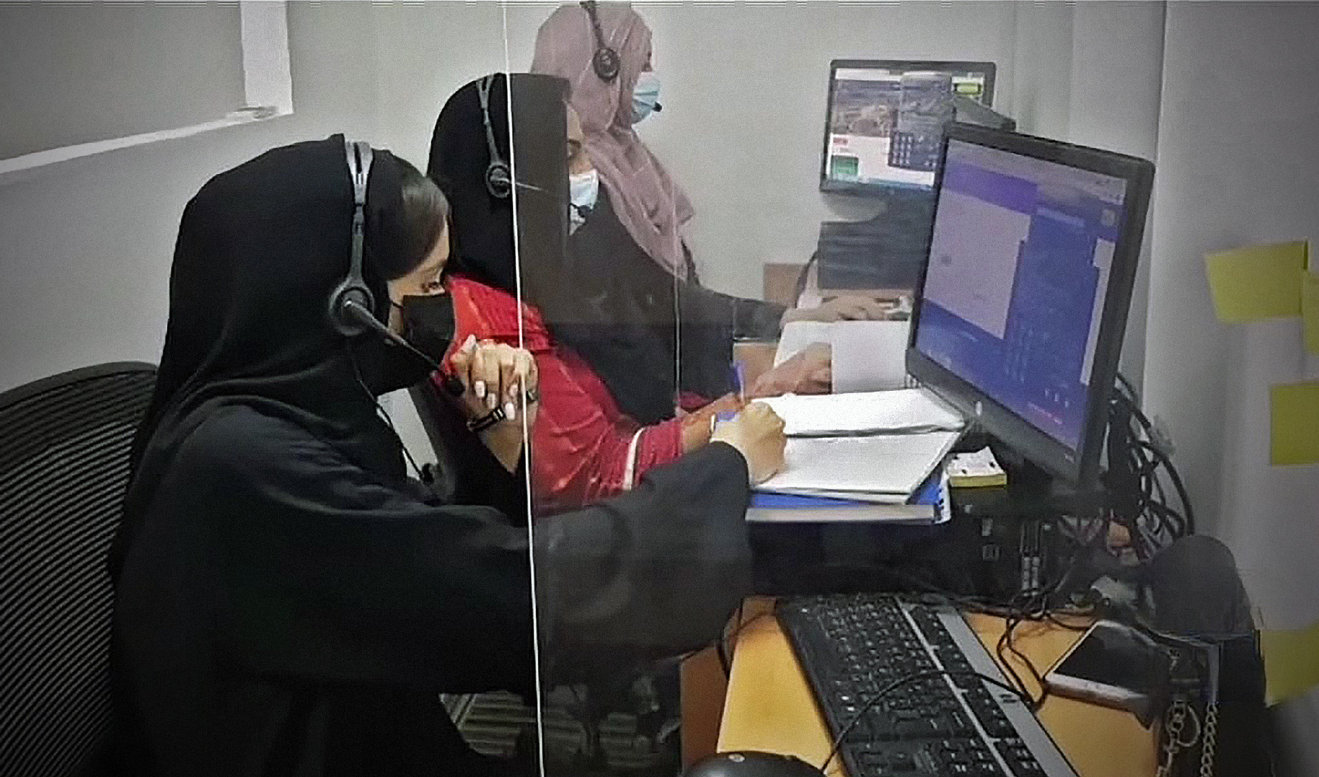 Staff at a newly launched call center of Pakistan's consulate general in Dubai are seen working at their desks on July 25, 2021. (Photo courtesy: Pakistan Consulate Dubai)