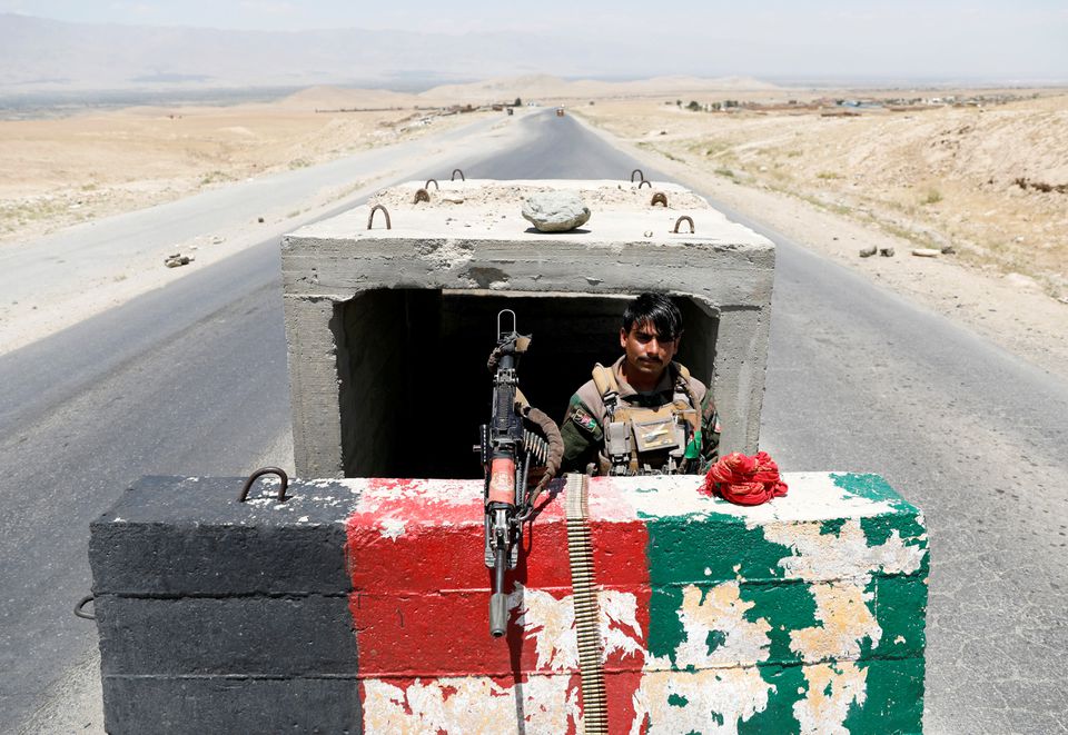 An Afghan National Army soldier stands guard at a checkpoint near Bagram Air Base on the day the last American troops vacated it, in Parwan province, Afghanistan, July 2, 2021. (REUTERS)