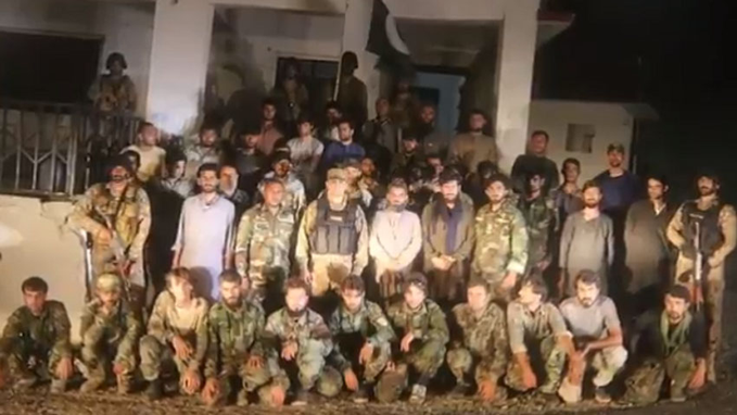 Pakistani army officers posing for a photo with Afghan security personnel and civilians in Nawapass Bajaur, Pakistan on July 27, 2021. (Photo courtesy: ISPR)