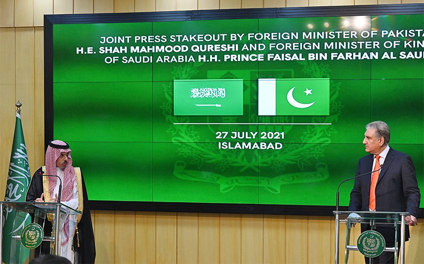 Pakistan's Foreign Minister Shah Mahmood Qureshi (R) and Saudi Foreign Minister Prince Faisal Bin Farhan Al-Saud (L) speak during a joint press conference at the Foreign Ministry in Islamabad on July 27, 2021. (AFP)