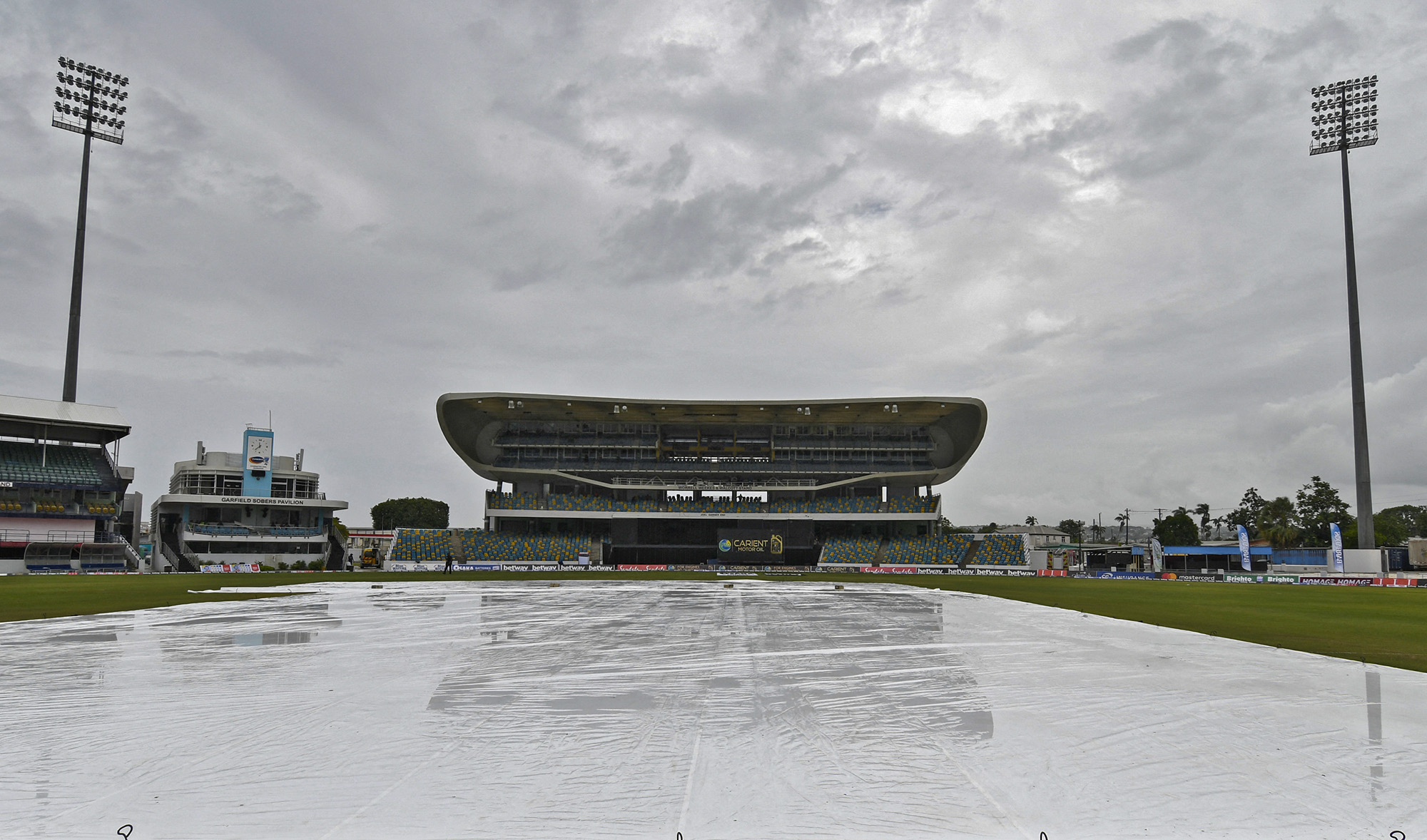 Covers are on as rain delays the start of the 1st T20I between West Indies and Pakistan at Kensington Oval, Bridgetown, Barbados, on July 28, 2021. (AFP)