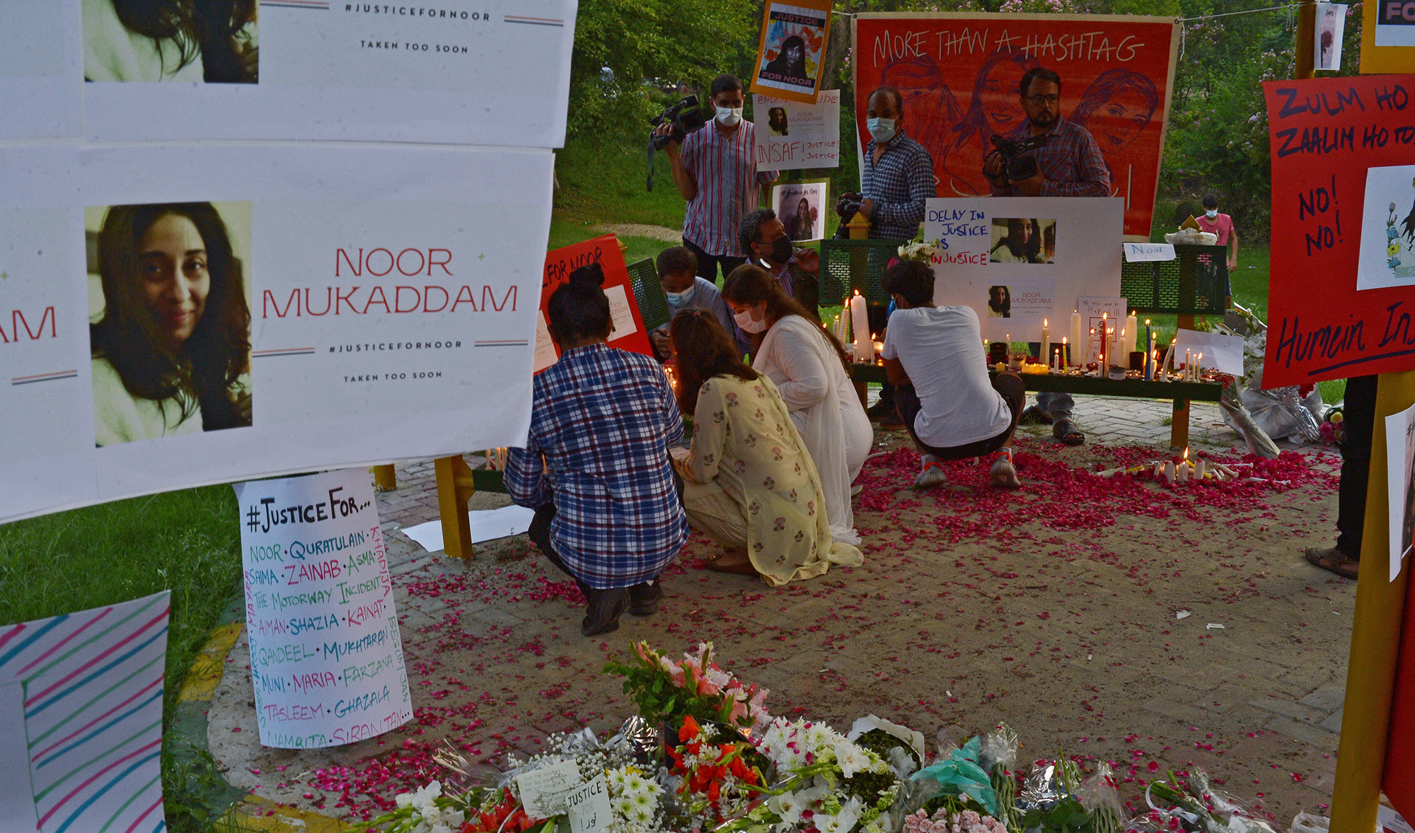 Women rights activists light candles at a park in Islamabad on July 25, 2021, against the brutal killing of Noor Mukadam, the daughter of former Pakistan envoy to South Korea, in Islamabad this week. (AFP)