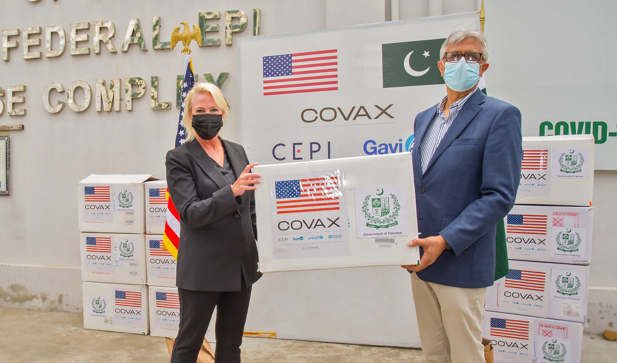 Dr. Faisal Sultan, Pakistani prime minister's assistant on health, on National Health Services, receives Moderna vaccines from U.S. Embassy Chargé d’affaires Angela Aggeler in Islamabad on July 29, 2021. (Photo courtesy: @USEmbIslamabad/Twitter)