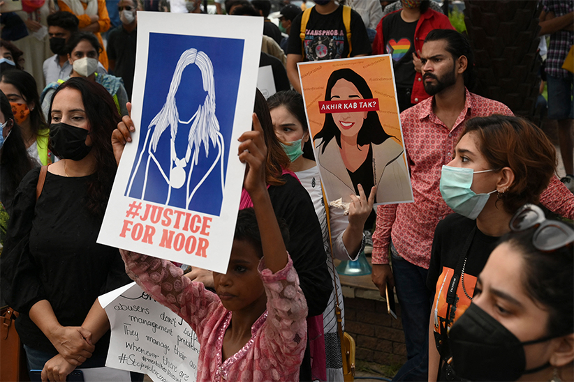 Women rights activists hold placards during a demonstration in Lahore on July 24, 2021. (AFP)