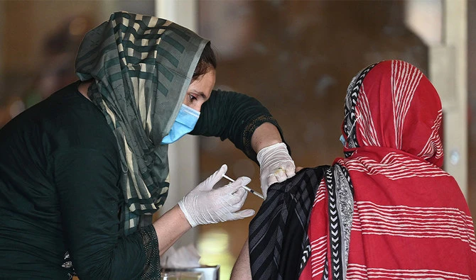 A woman receives the second dose of coronavirus Sinopharm vaccine at a vaccination camp in Islamabad, Pakistan, on May 20, 2021. (AFP)
