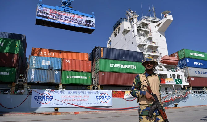 A Pakistani Naval personnel stands guard beside a ship carrying containers during the opening of a trade project in Gwadar port, some 700 kms west of Karachi on November 13, 2016. (AFP/File)