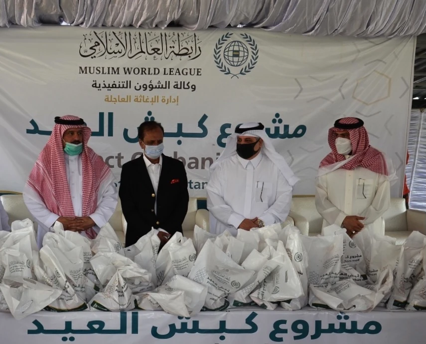 Muslim World League officials and Nawaf bin Said Al-Malki, Saudi Arabia’s ambassador to Pakistan, distribute portions of sacrificial meat to poor families in Islamabad on July 21, 2021. (Photo courtesy: Saudi Embassy in Islamabad)