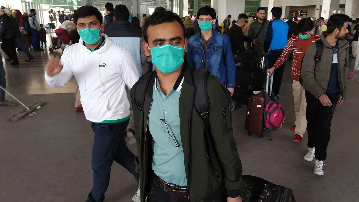 Pakistani passengers wearing face masks arrive at the Islamabad International Airport on February 3, 2020. (AFP/File)