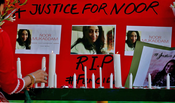 Women's rights activists place candles and flowers beside posters with the pictures of Noor Mukadam, who was recently beheaded, during a candle light vigil to pay tribute to Noor and other domestic violence victims in Islamabad, Pakistan, (AP)