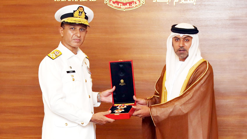 Pakistan's naval chief Admiral Muhammad Amjad Khan Niazi being conferred with the highest military medal of the United Arab Emirates by Ambassador Hamad Obaid Al-Zaabi at UAE embassy in Islamabad on August 5, 2021. (Photo courtesy: Radio Pakistan)