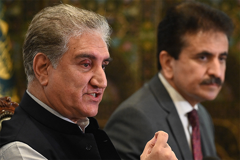 Pakistan's Foreign Minister Shah Mahmood Qureshi (L) speaks during a press conference over the ongoing situation in Afghanistan, at the Foreign Ministry in Islamabad on August 9, 2021. (AFP)