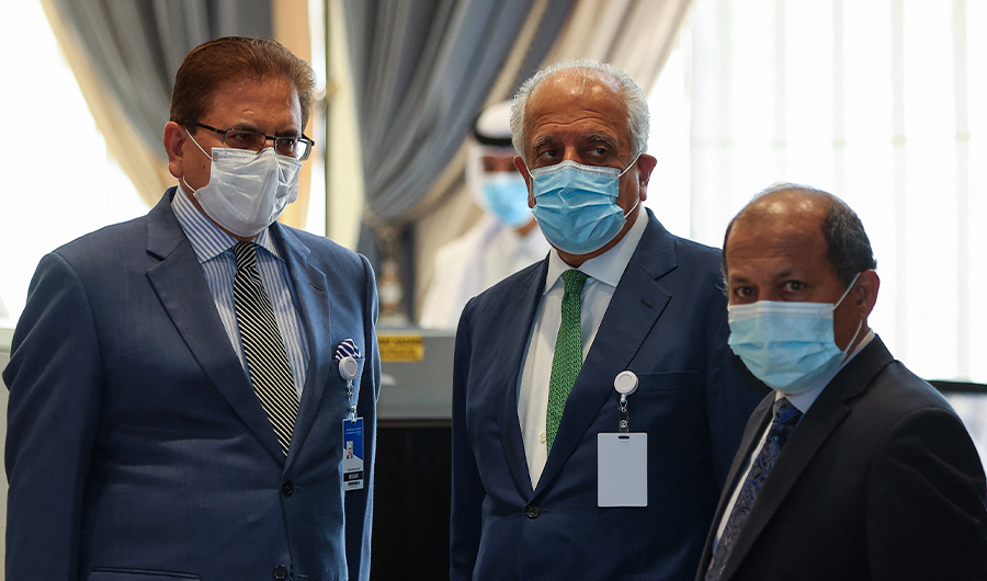 Pakistan's Special Representative for Afghanistan Mohammad Sadiq (L) and US special envoy for Afghanistan Zalmay Khalilzad (C) arrive in Qatar's capital Doha for an international meeting on Afghanistan, August 10, 2021. (AFP)