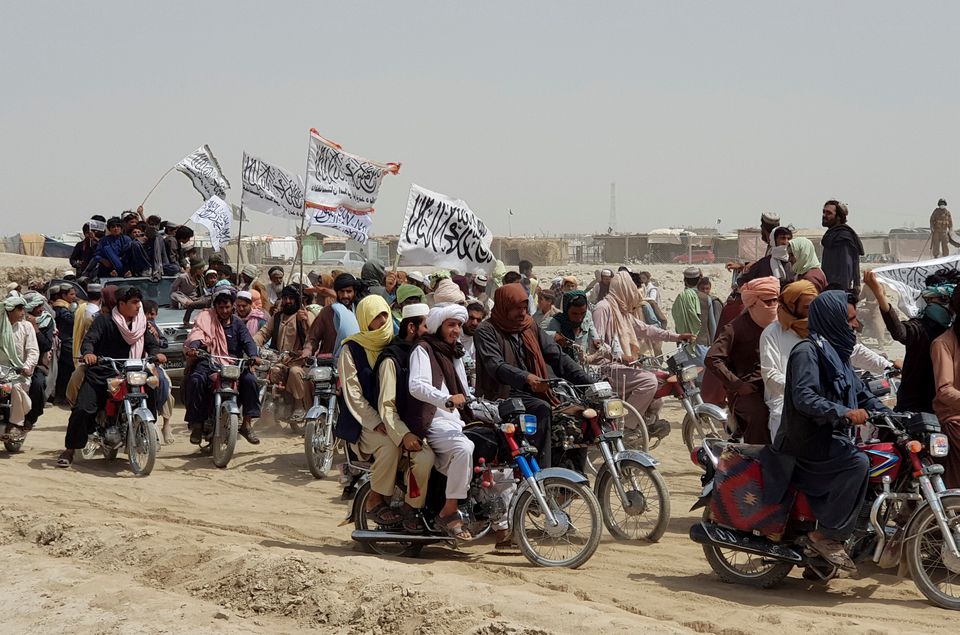 People on vehicles, holding Taliban flags, gather near the Friendship Gate crossing point in the Pakistan-Afghanistan border town of Chaman, Pakistan July 14, 2021. Picture taken July 14, 2021. (REUTERS)