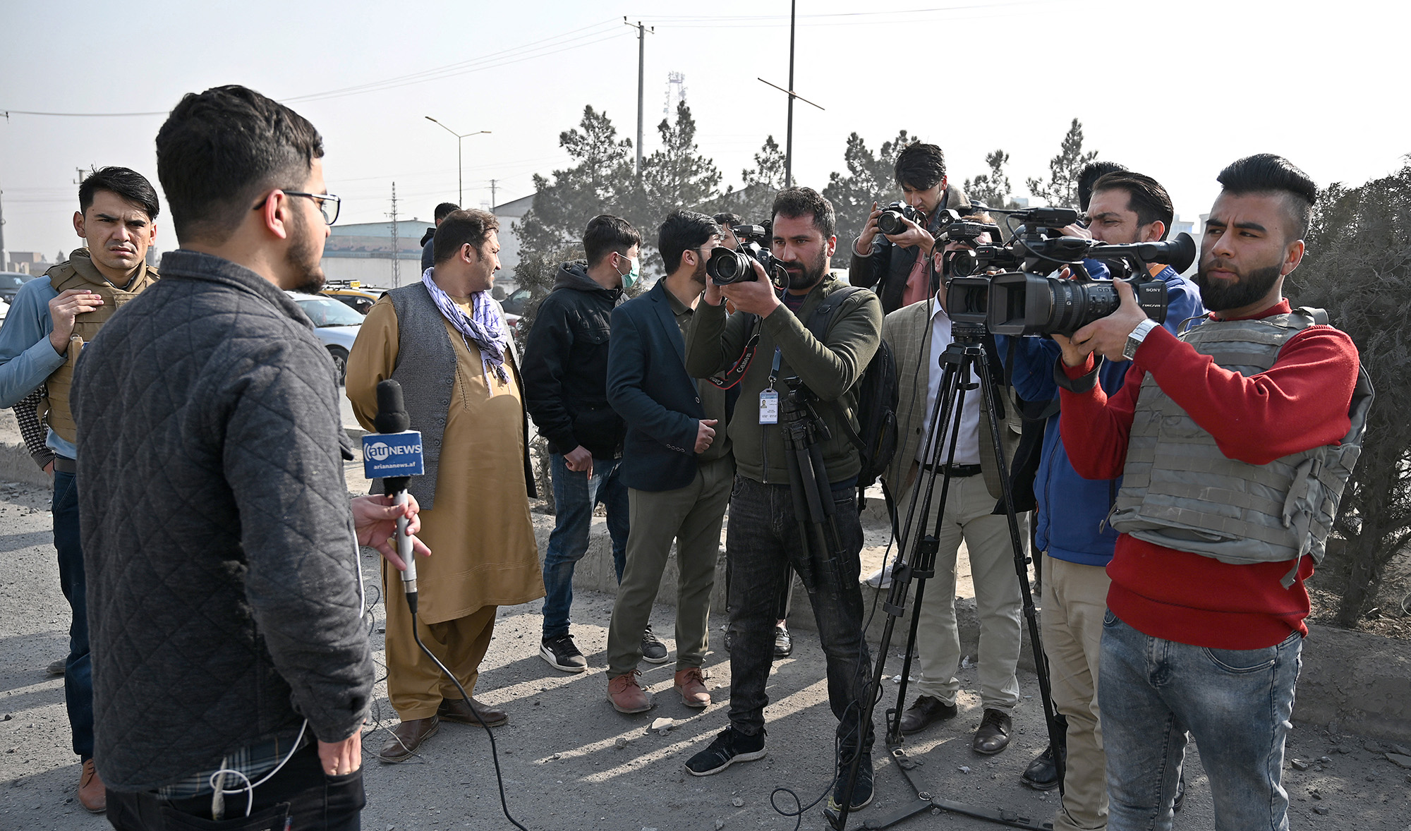 Journalists reports at the site of a bomb blast in Kabul, Afghanistan, on February 2, 2021. (AFP/File)
