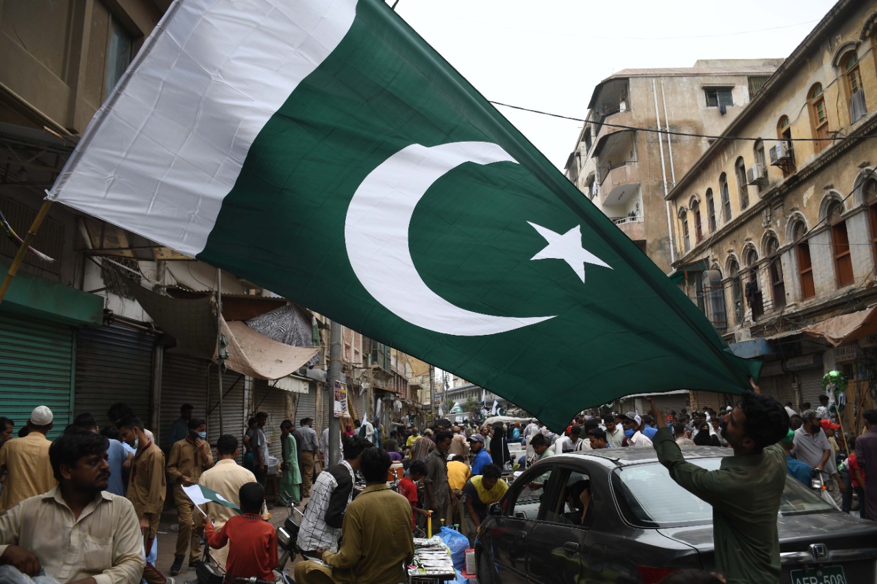 A vendor is selling a Pakistan flag at the paper market in Karachi on August 13, 2021, ahead of the country’s Independence Day on August 14. (AN Photo)