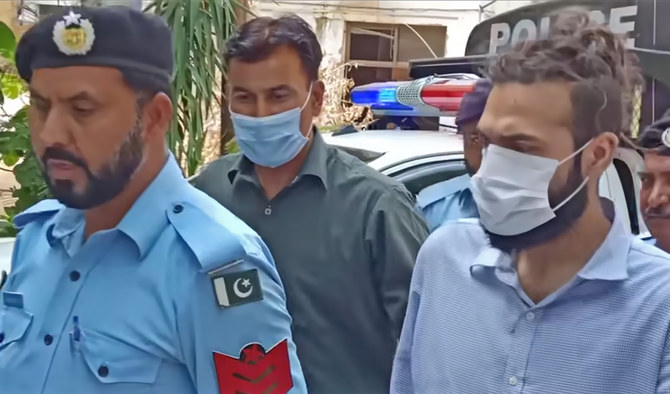 Zahir Zakir Jaffer (right), main suspect in the gruesome July 20 murder of Noor Mukadam, is led by Islamabad police officers to the court in Islamabad, Pakistan, on August 2, 2021. (Photo courtesy: Social Media)