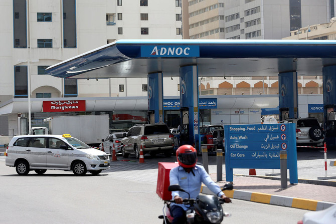 A man rides a motorcycle near an ADNOC petrol station in Abu Dhabi, United Arab Emirates July 10, 2017. (REUTERS)