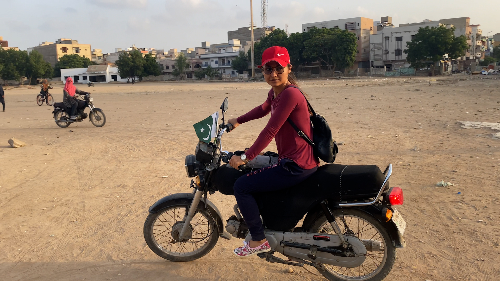 Marina Syed seen with her bike in Karachi, Pakistan, on August 10, 2021. (AN photo)