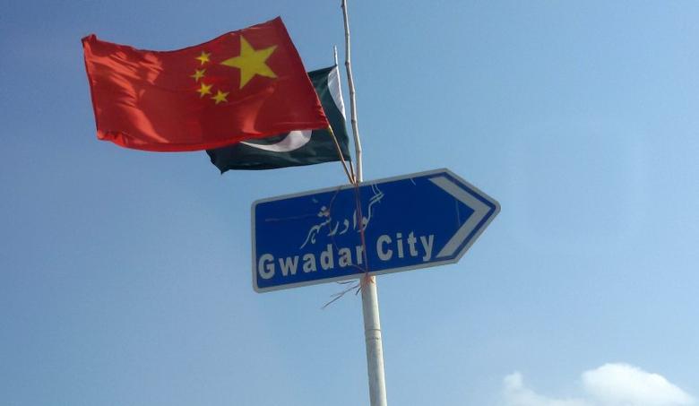 The Chinese and Pakistani flags fly on a sign along a road towards Gwadar, Pakistan January 26, 2016. (REUTERS)