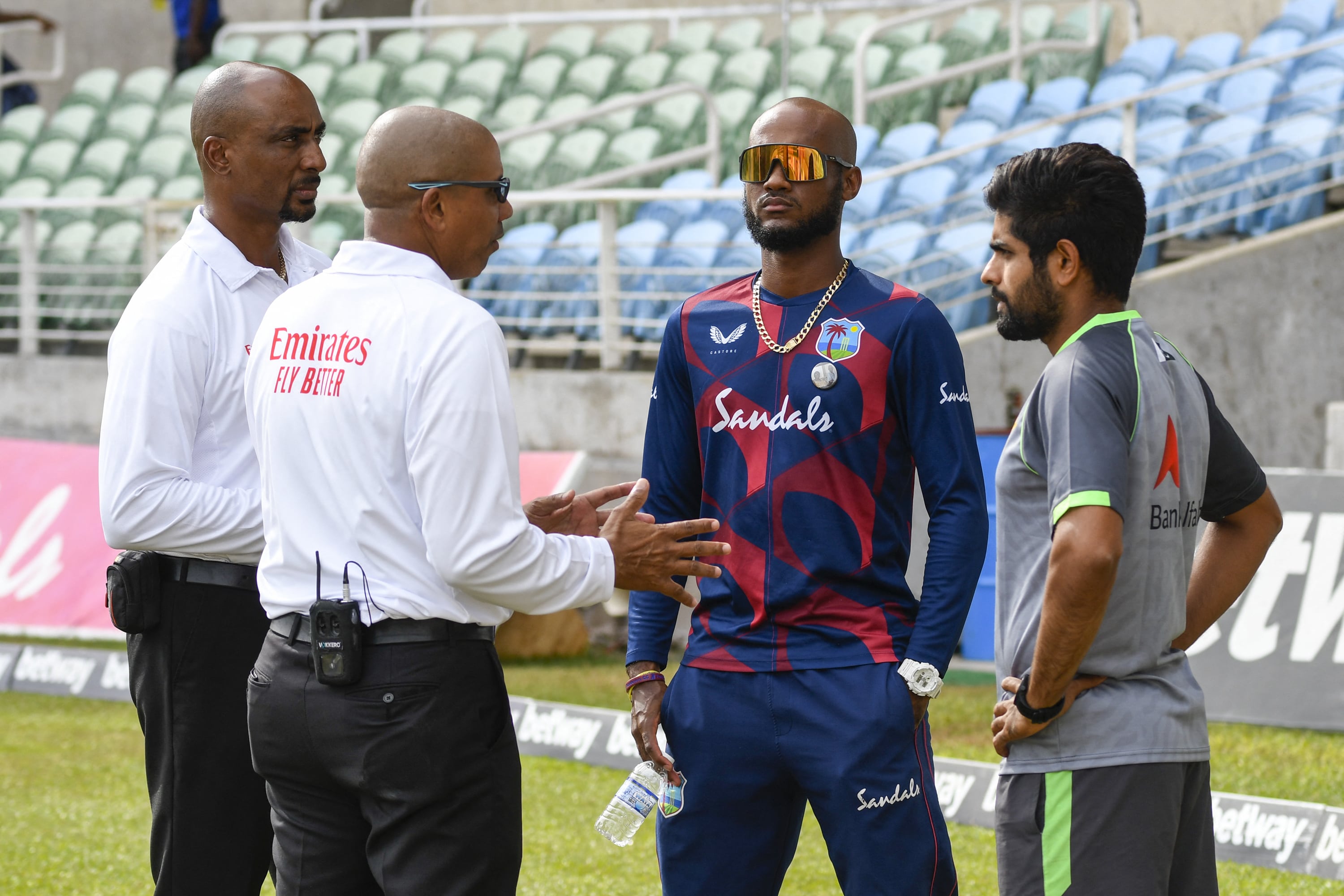 Umpires Gregory Brathwaite (L) and Joel Wilson (2L), Kraigg Brathwaite (2R) of West Indies and Babar Azam (R) of Pakistan cancel day 2 of the 2nd Test between West Indies and Pakistan at Sabina Park, Kingston, Jamaica, on August 21, 2021. (AFP)
