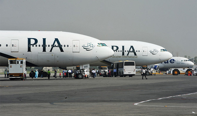 Pakistan International Airline (PIA) planes are positioned on the tarmac at the Benazir Bhutto International Airport in Islamabad on October 10, 2012. (AFP/ File)