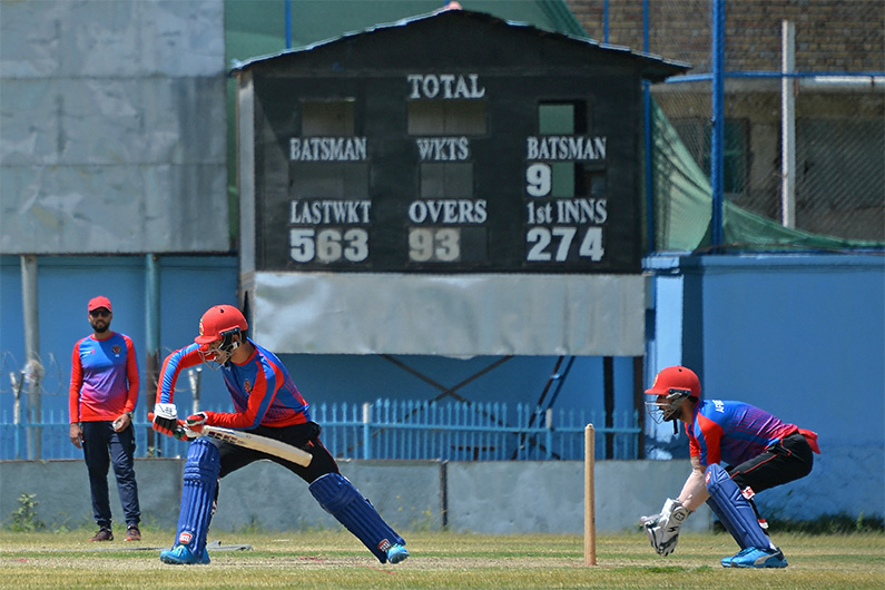 Afghanistan's national cricket team players attend a training session at the Kabul International Cricket Ground in Kabul on August 21, 2021. (AFP)