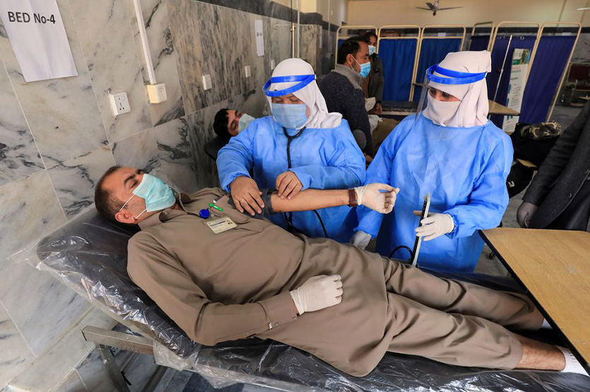 A health workers goes through a medical check-up after receiving a dose of Sinopharm's coronavirus disease (COVID-19) vaccine at a vaccination centre in Peshawar, Pakistan February 3, 2021. (AFP)
