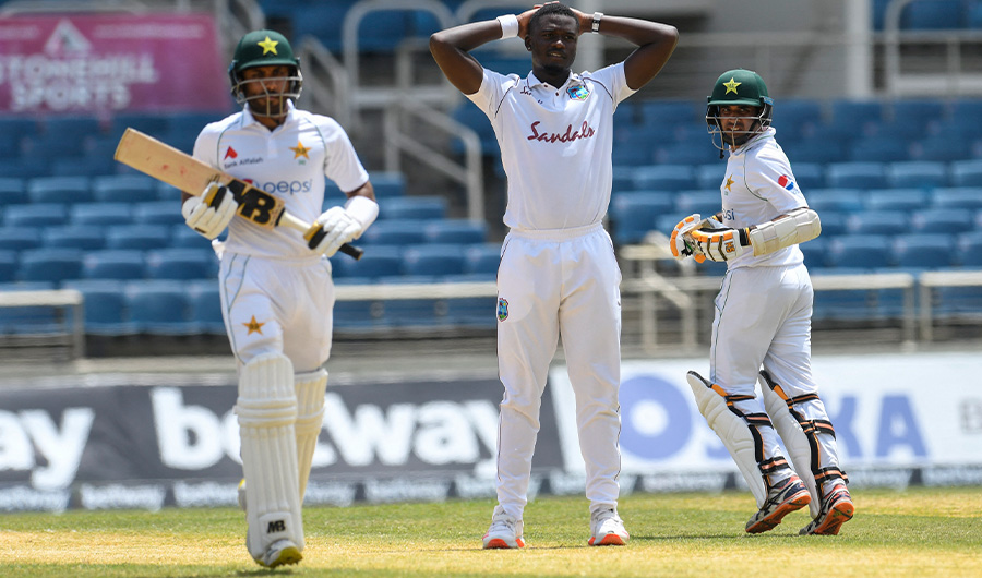 Jayden Seales (C) of West Indies expresses disappointment as Abid Ali (R) and Imran Butt (L) of Pakistan run during day 4 of the 2nd Test between West Indies and Pakistan at Sabina Park, Kingston, Jamaica, on August 23, 2021. (AFP)