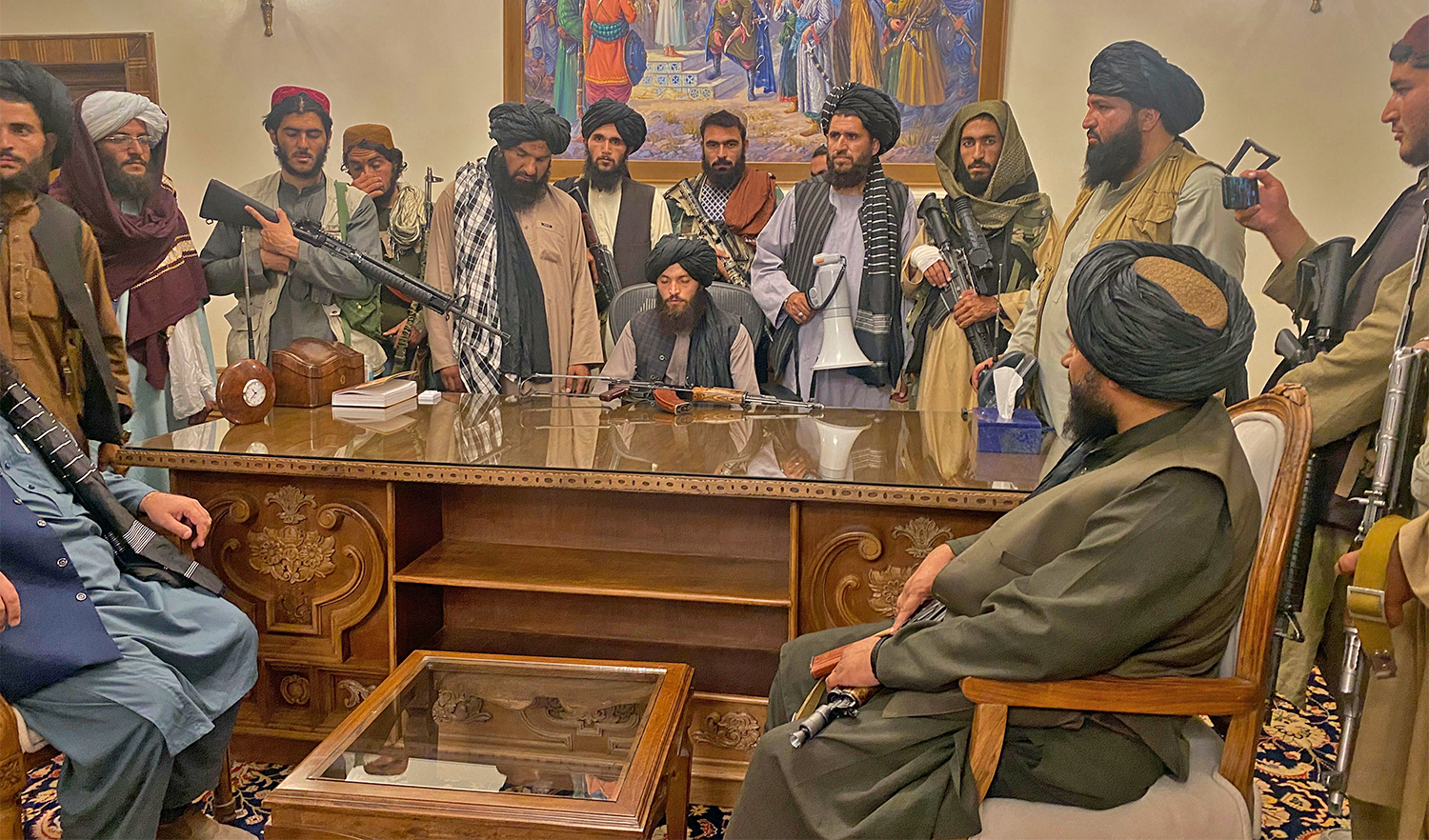 Taliban fighters take control of Afghan presidential palace after the Afghan President Ashraf Ghani fled the country, in Kabul, Afghanistan on August 15, 2021. (AP)