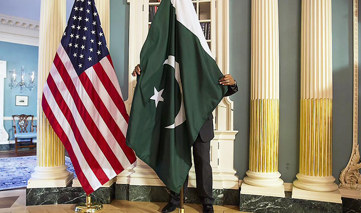 A State Department contractor adjust Pakistan national flag before a meeting at the State Department in Washington on February 19, 2015. (REUTERS/File)