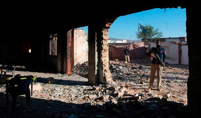Policemen stand guard at the burnt Hindu temple a day after a mob attack in a remote village in Karak district, some 160 kms southeast of Peshawar on December 31, 2020. (AFP/ File)