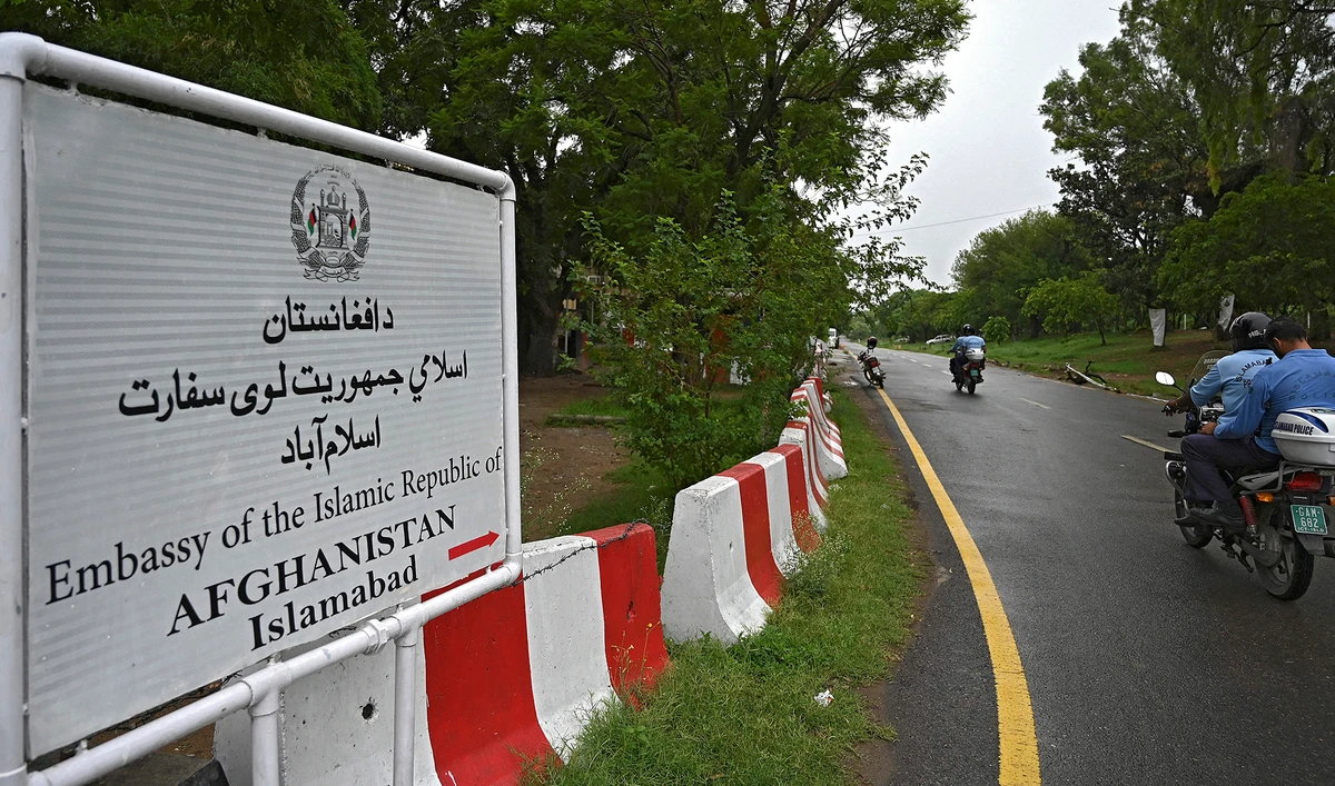 Policemen ride past the Afghan Embassy in Islamabad on July 19, 2021. (AFP)