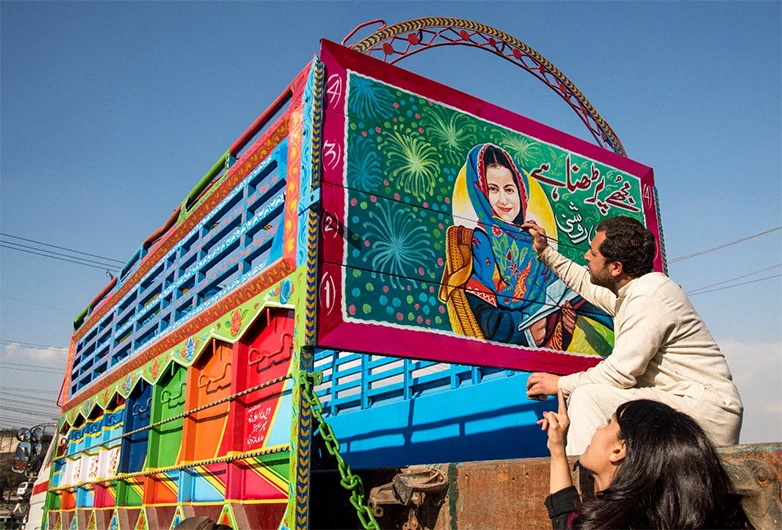 A truck artist paints a portrait of a missing child for the Truck Art Child Finder project of Roshni Helpline and Berger Paints in Karachi, Pakistan, 2019. (Photo courtesy: Samar Minallah)
