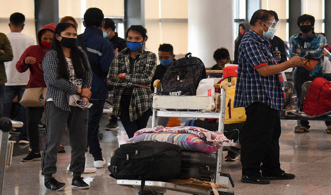 Stranded passengers wait for updates at the airport in Manila, Philippines on August 4, 2020. (AFP/ File)