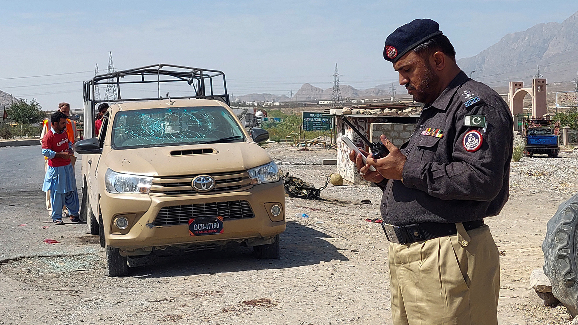 A police officer and rescue workers survey the site after a suicide blast on paramilitary force checkpoint in Quetta, Pakistan September 5, 2021. (REUTERS)