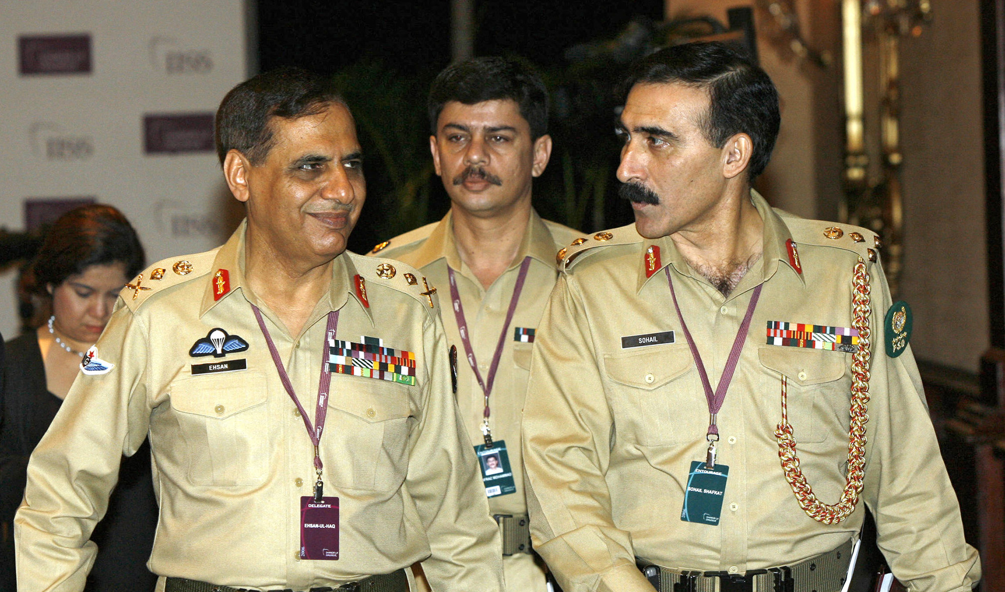 Pakistan former intelligence chief, General Ehsan-ul-Haq, left, with his officers leave the ballroom after the plenary session during the 5th Anniversary IISS Asia Security Summit in Singapore on June 4, 2006. (AFP/File)