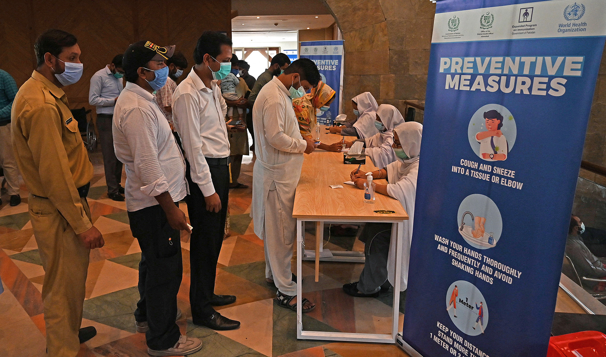 People register to get a dose of the Covid-19 coronavirus Sinovac vaccine at a mass vaccination centre in Islamabad on June 3, 2021. (AFP/File)