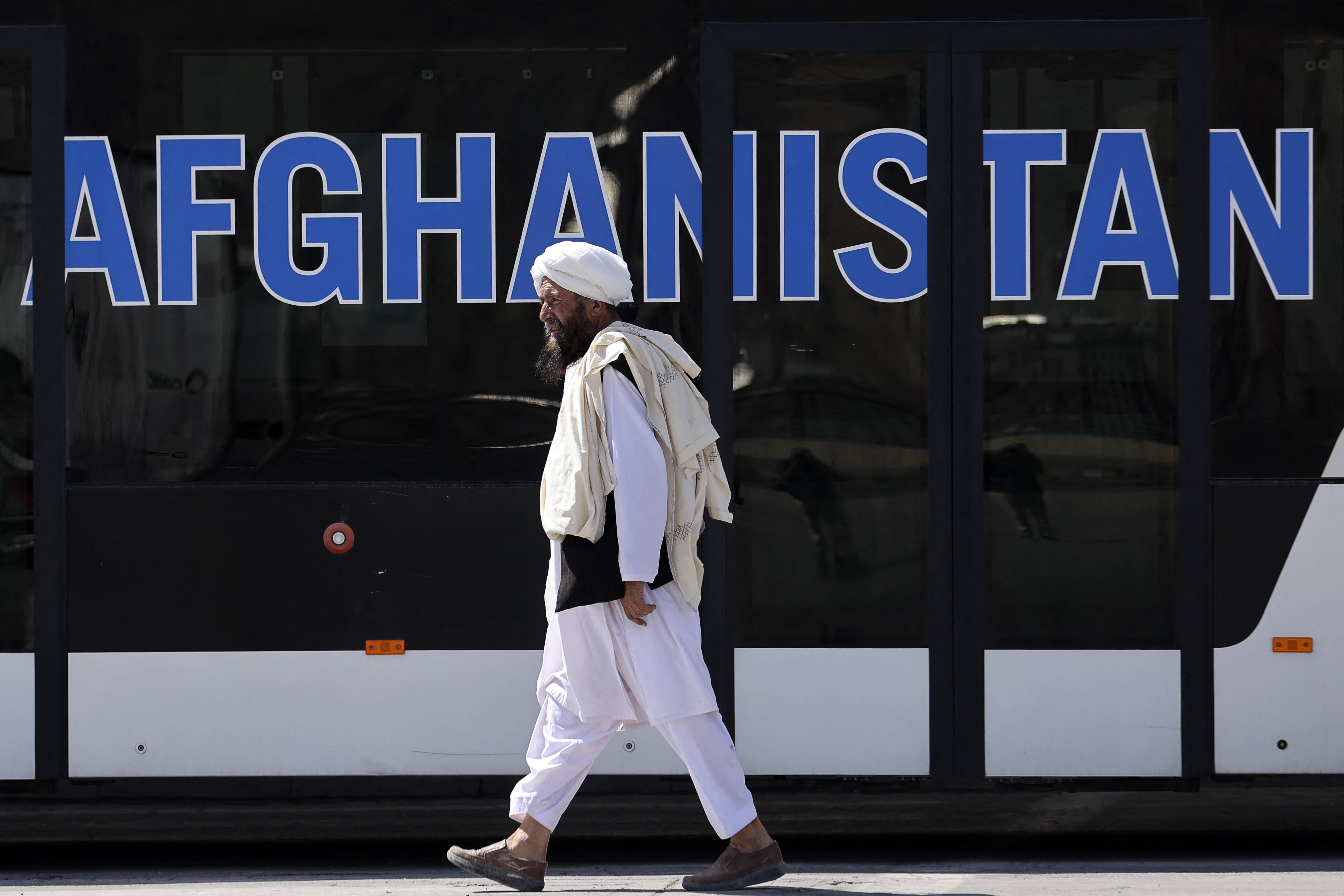 A member of the Taliban walks at the airport in Kabul on September 13, 2021. (AFP)