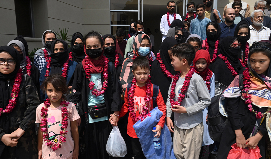 Members of Afghanistan's national girls football team arrive at the Pakistan Football Federation (PFF) in Lahore on September 15, 2021. (AFP)