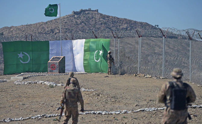 A Pakistani soldier patrols next to newly fenced border fencing along with Afghan's Paktika province border in Angoor Adda in Pakistan's South Waziristan tribal agency on Oct. 18, 2017. (AFP/File)