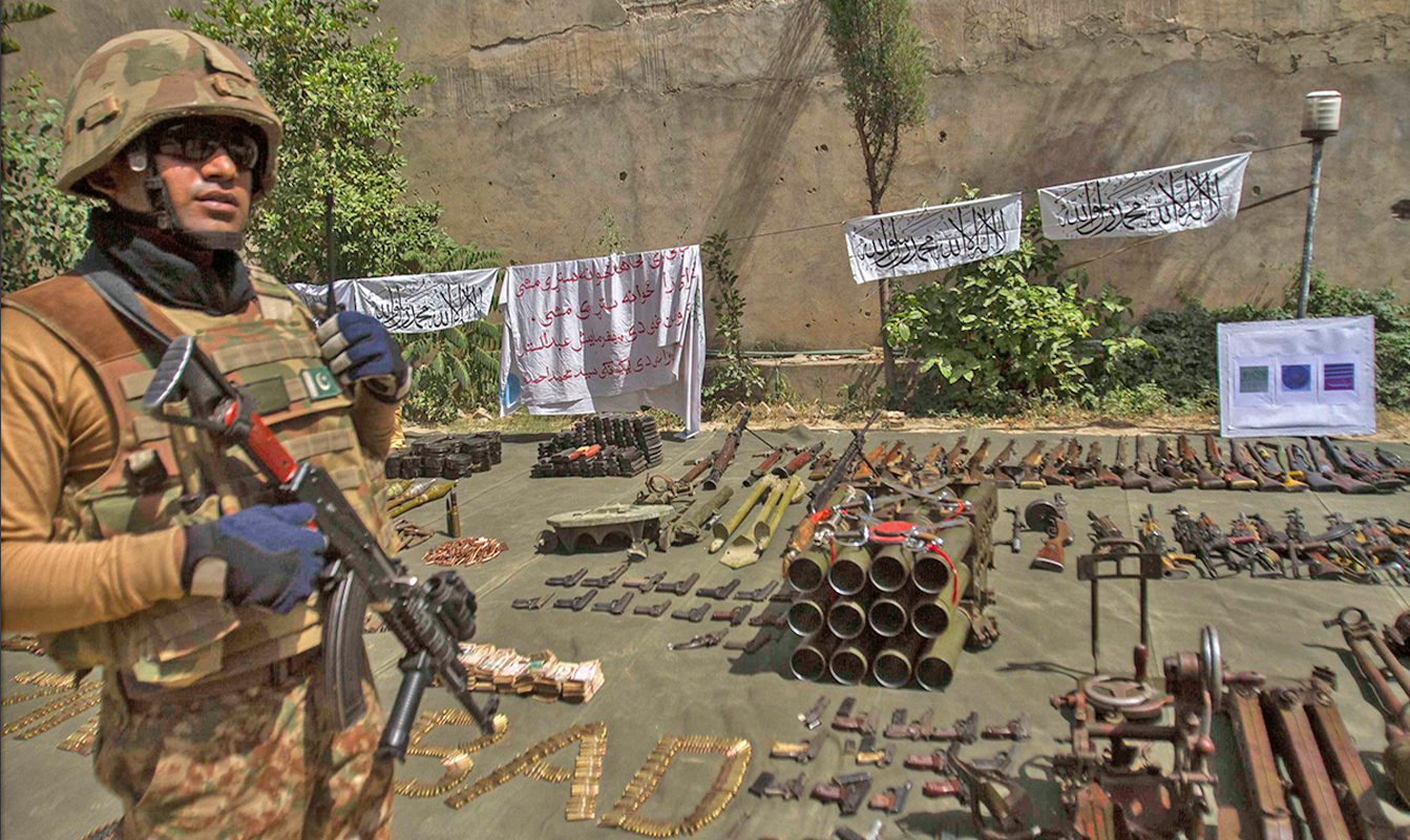 A soldier stands by ammunition seized during a military operation against Taliban militants, in the of town of Miramshah, North Waziristan, on July 9, 2014. (REUTERS/File)
