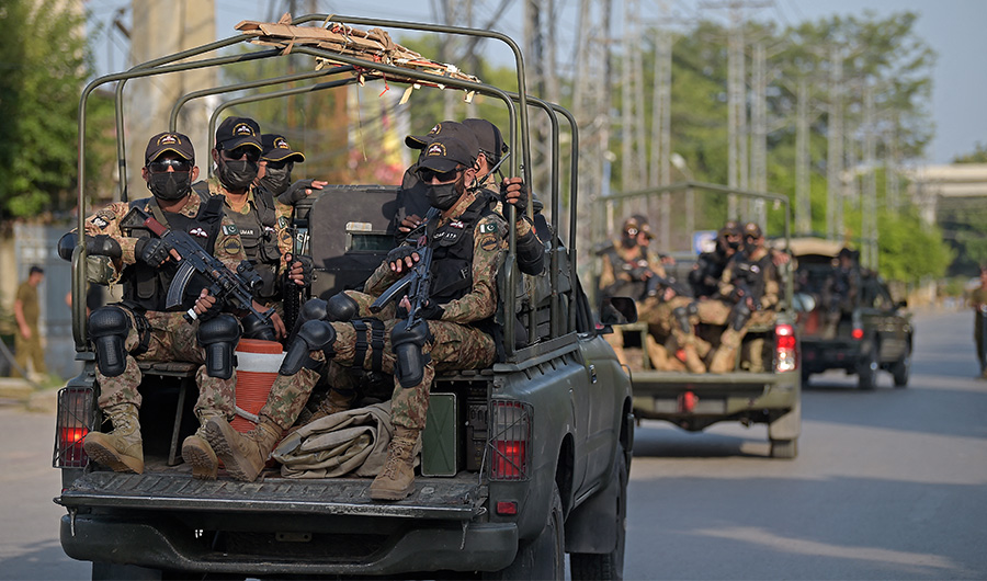 Pakistan's army commandos depart in their vehicles after escorting a convoy of vans carrying New Zealand's and Pakistani players to the Rawalpindi Cricket Stadium in Rawalpindi on September 13, 2021. (AFP)
