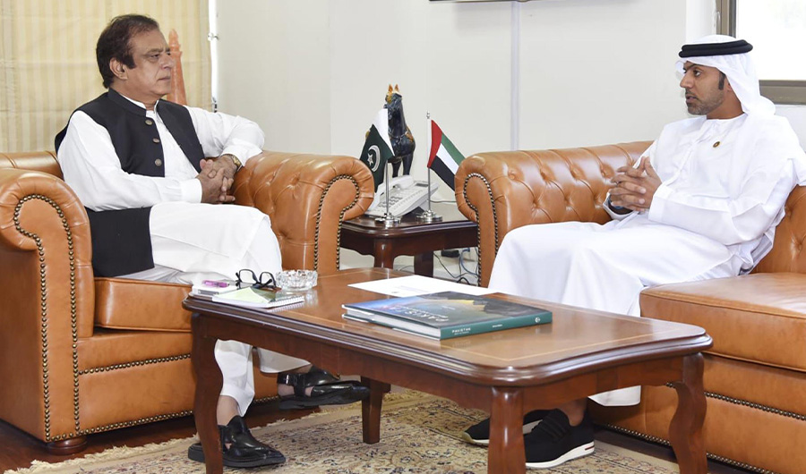 Pakistani Science and Technology Minister Shibli Faraz speaks with UAE Ambassador to Pakistan Hamad Obaid Ibrahim Salem Al-Zaabi in Islamabad on September 14, 2021. (Photo courtesy: PID)