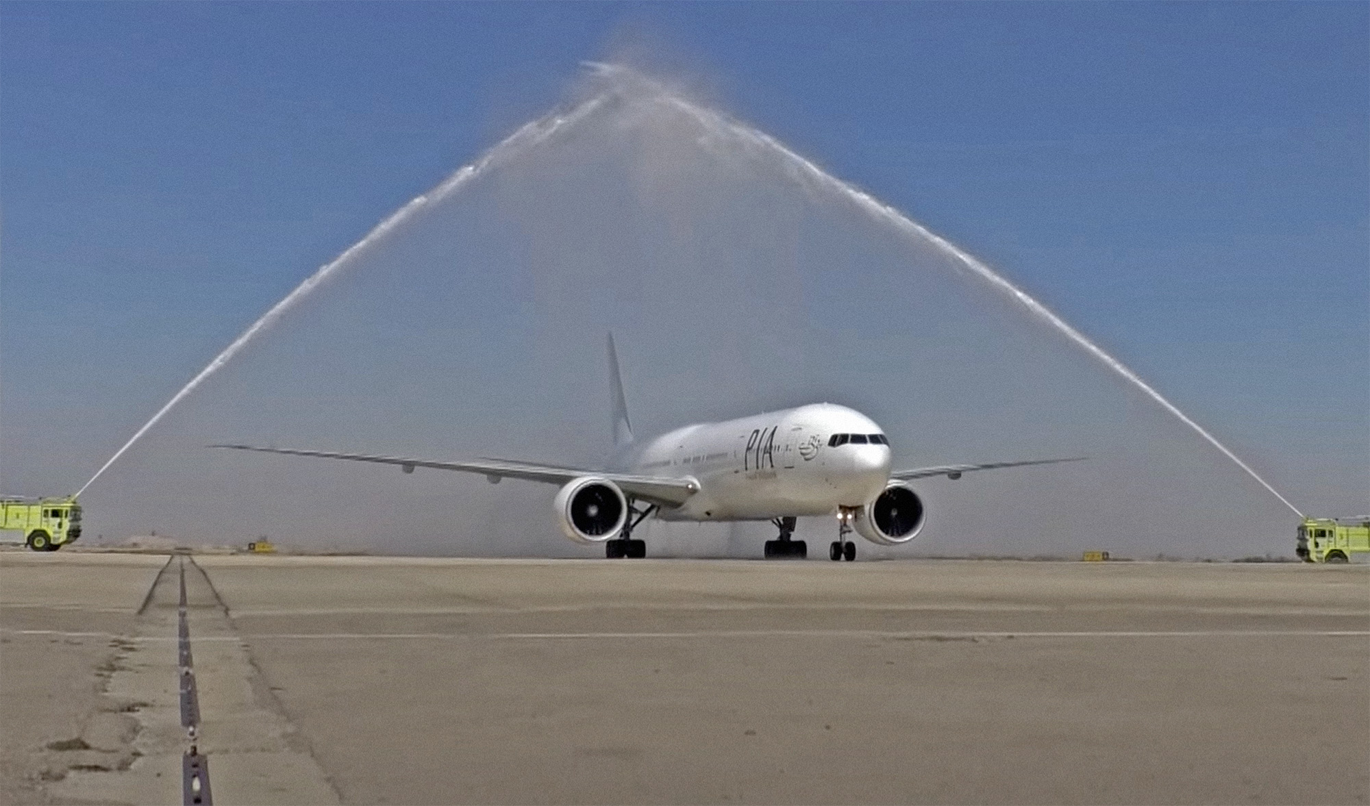 A Pakistan International Airlines (PIA) aircraft receives water salute at the Damascus International Airport, Syria, on September 17, 2021, as it becomes the first Pakistani flight to land in Damascus in 22 years. (SANA)